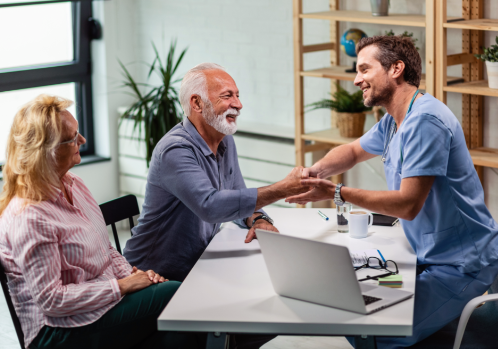 Standing at the Brink of a Change: How Patient Engagement Technology Transforms Healthcare 5 People discussing patient engagement technology