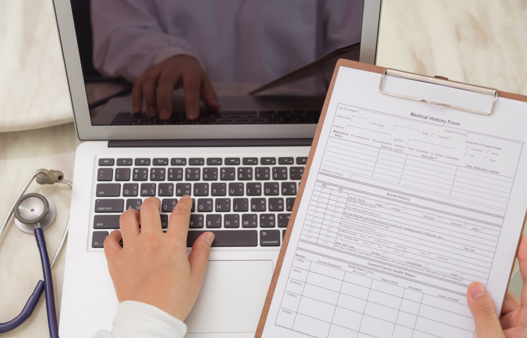 Revolution in Healthcare Data Warehouse: A Glimpse into New Era of Data-Driven Solutions 3 A doctor working with medical history forms